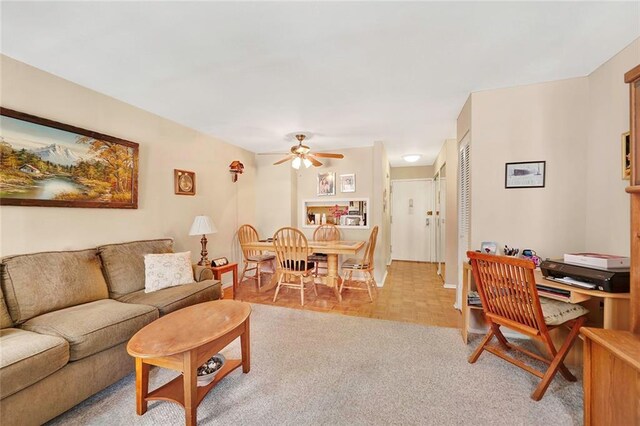 living room with light parquet floors and ceiling fan