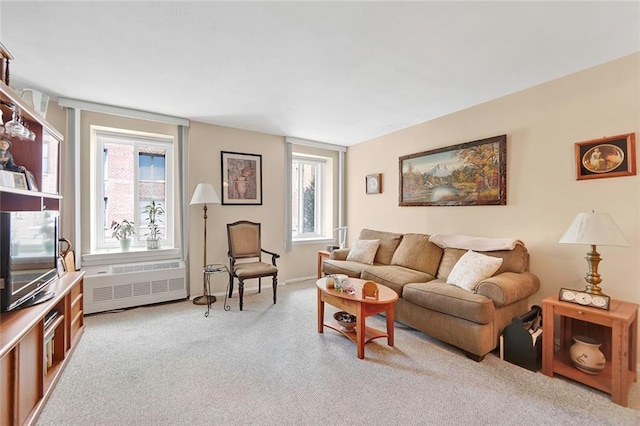 carpeted living room with radiator