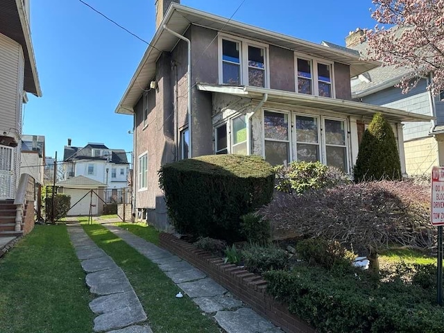 view of property exterior featuring a yard