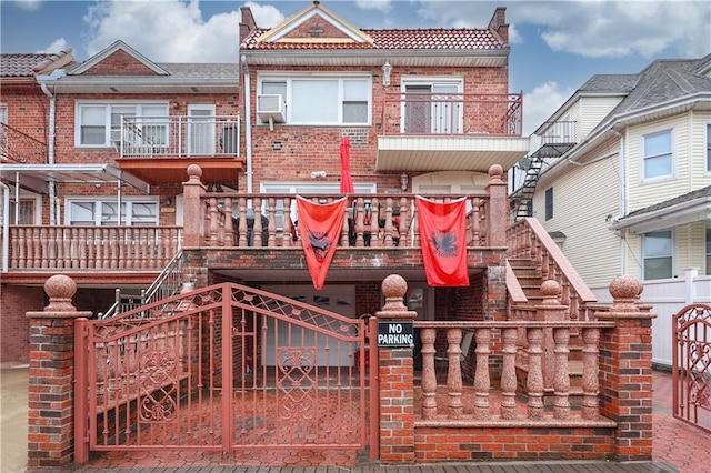 view of front of house featuring a balcony