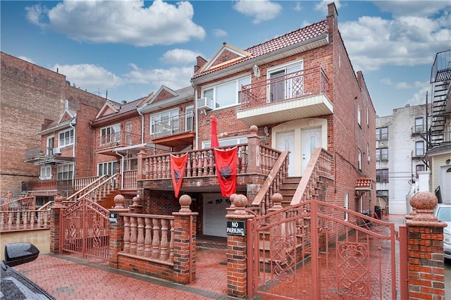 exterior space featuring a balcony and cooling unit