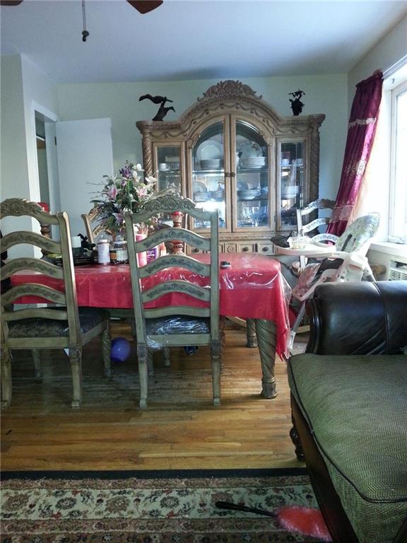 dining room with ceiling fan and hardwood / wood-style floors