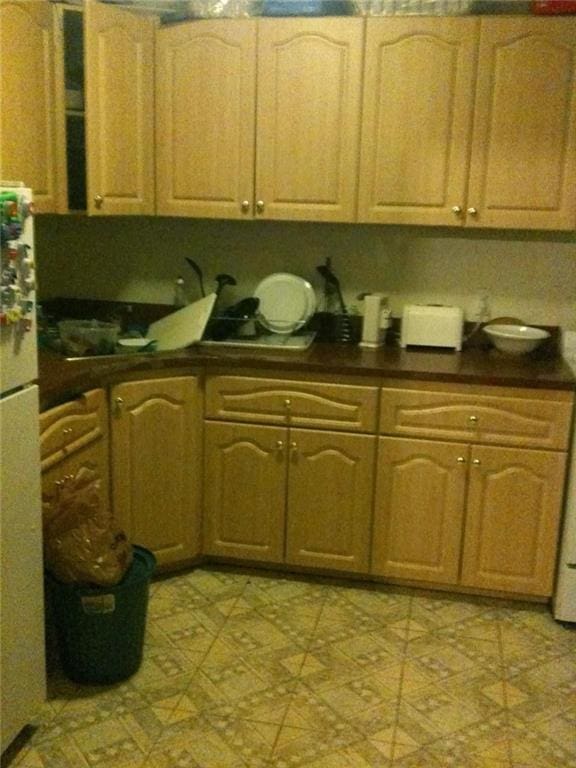 kitchen featuring white refrigerator