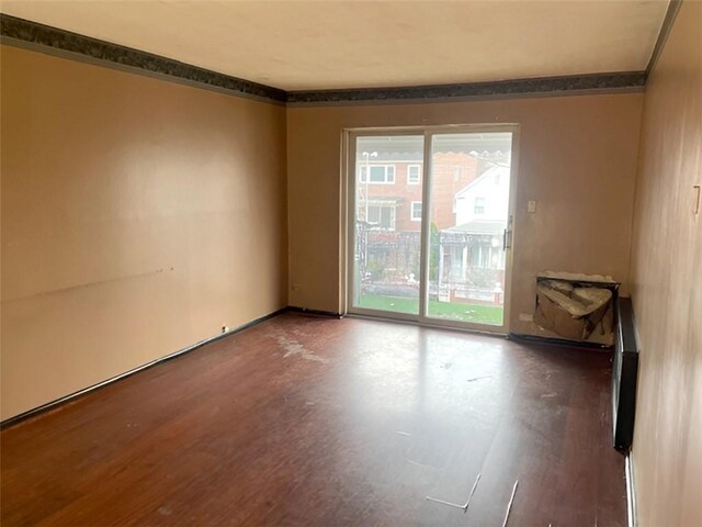 unfurnished room featuring crown molding