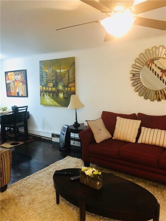 living room featuring a baseboard radiator and ceiling fan