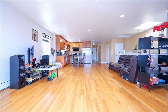 living room with light hardwood / wood-style floors