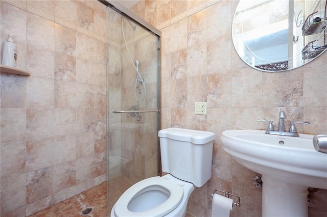 bathroom featuring an enclosed shower, toilet, and tile walls