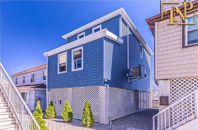 view of property exterior featuring stairway