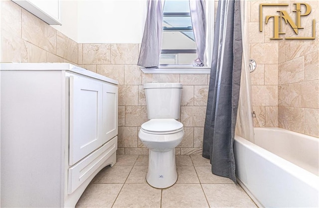 14 Webers Ct, Brooklyn, NY 11235 - full bath with tile walls, toilet, tile patterned floors, and shower / bath combination with curtain