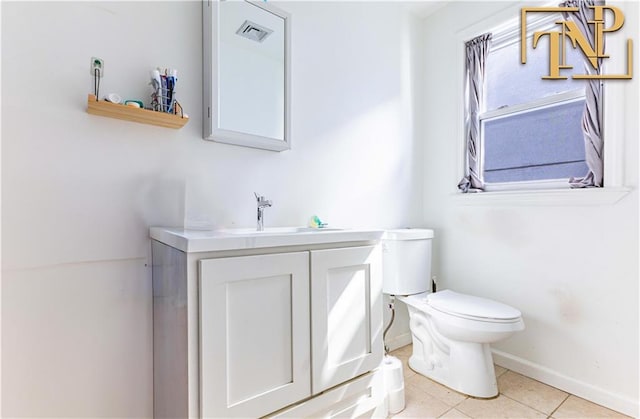 14 Webers Ct, Brooklyn, NY 11235 - half bath with baseboards, toilet, vanity, and tile patterned flooring