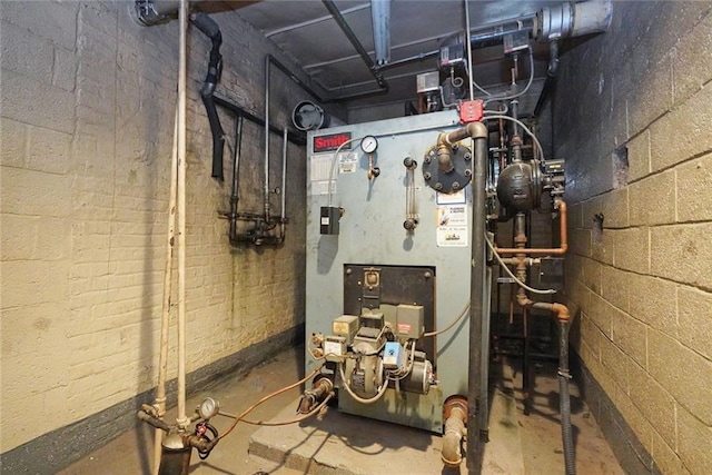 utility room featuring heating unit