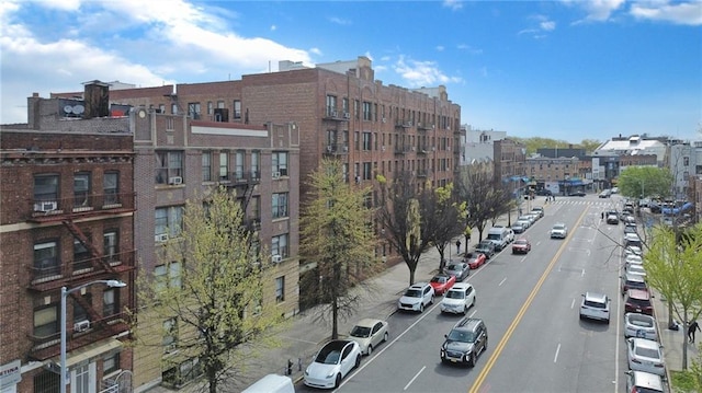 view of property featuring uncovered parking