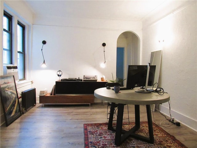 interior space featuring hardwood / wood-style flooring and radiator heating unit