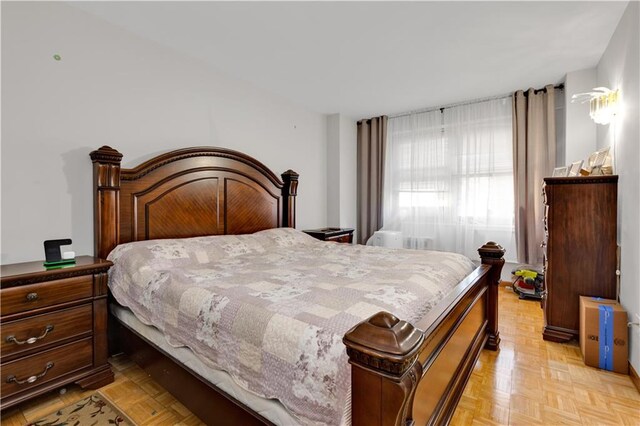 bedroom featuring light parquet floors