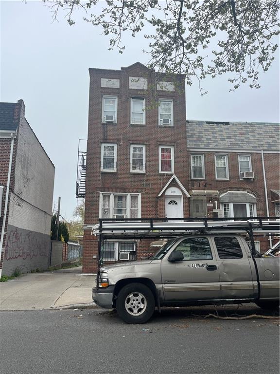 view of front of home with brick siding