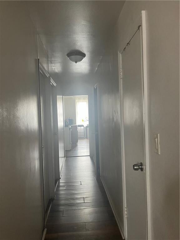 hallway featuring dark hardwood / wood-style floors