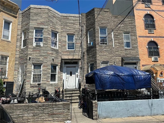 view of front facade featuring cooling unit