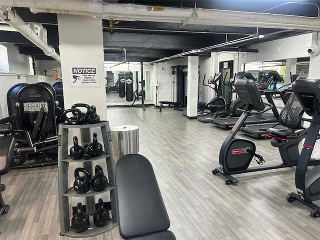 exercise room with wood finished floors