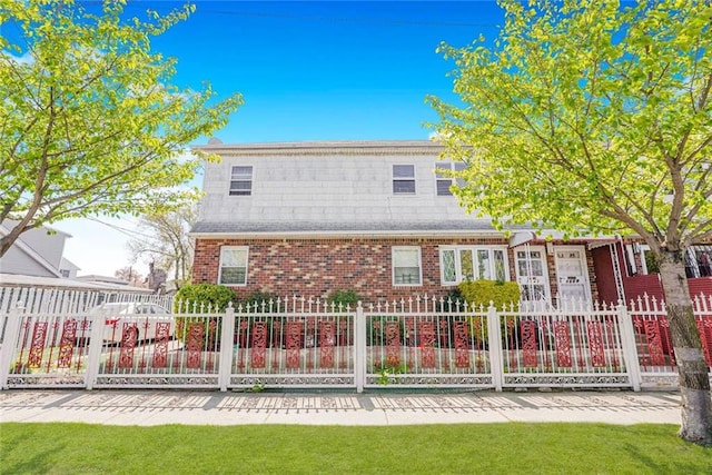 rear view of property featuring a yard