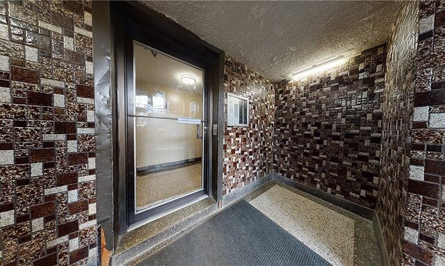 wine room featuring a textured ceiling