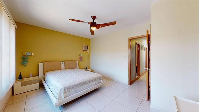 bedroom featuring light tile patterned floors and ceiling fan