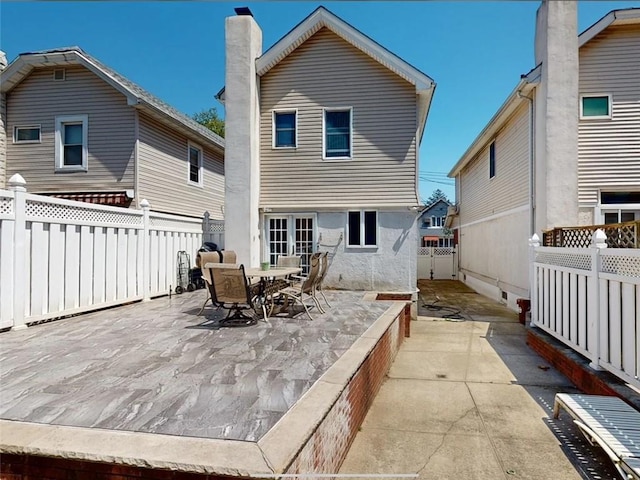 back of property featuring a patio area