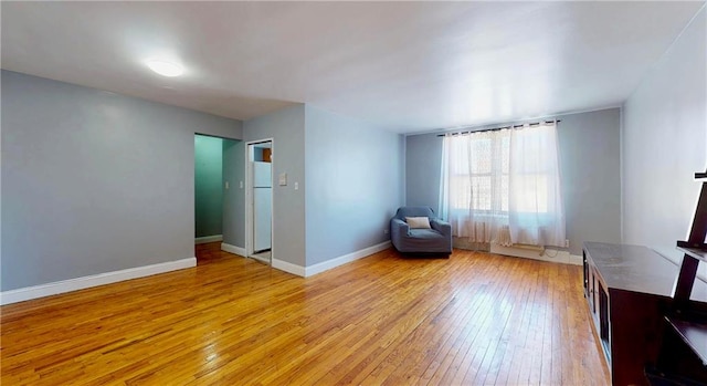 1934 Haring St, Brooklyn, NY 11229 - living area featuring baseboards and light wood-style flooring
