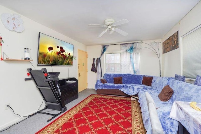 carpeted living room with ceiling fan