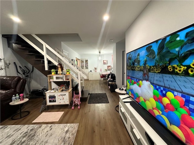 interior space with stairway and wood finished floors