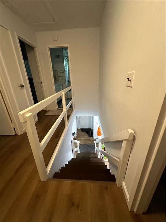 stairway with wood finished floors