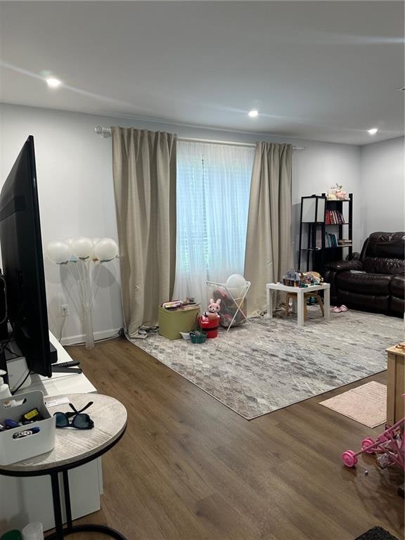 living area featuring recessed lighting and wood finished floors