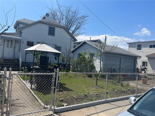 view of front of house with a gazebo and a front yard