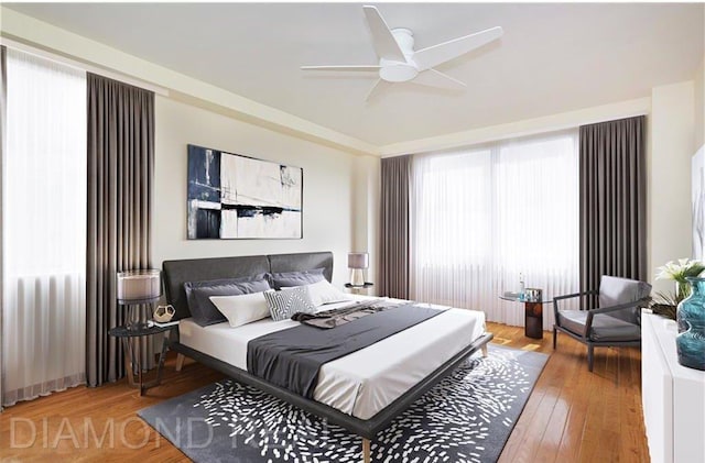 bedroom featuring ceiling fan and hardwood / wood-style floors