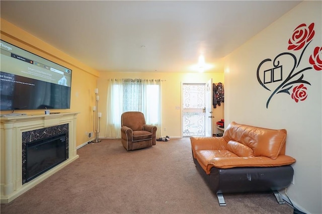 sitting room with carpet floors and a high end fireplace