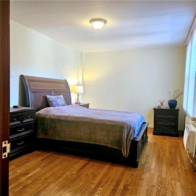 bedroom with light wood-type flooring