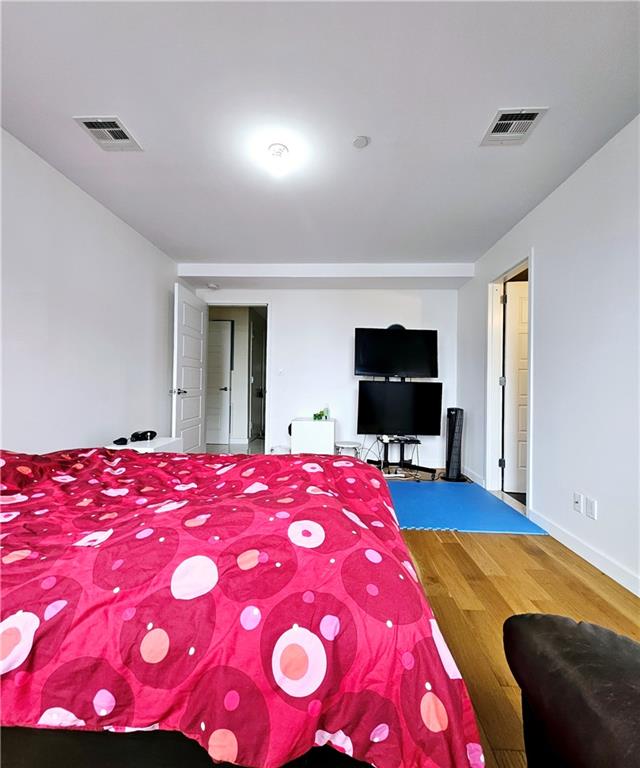 bedroom featuring hardwood / wood-style floors