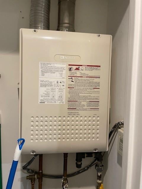 utility room with water heater