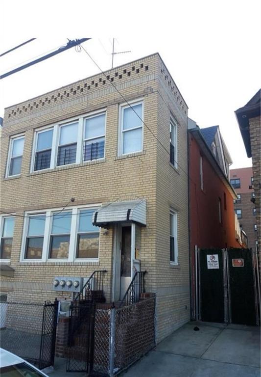 2530 Coney Island Ave, Brooklyn, NY 11223 - view of front facade with brick siding, fence private yard, and a gate