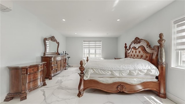 bedroom featuring a wall unit AC