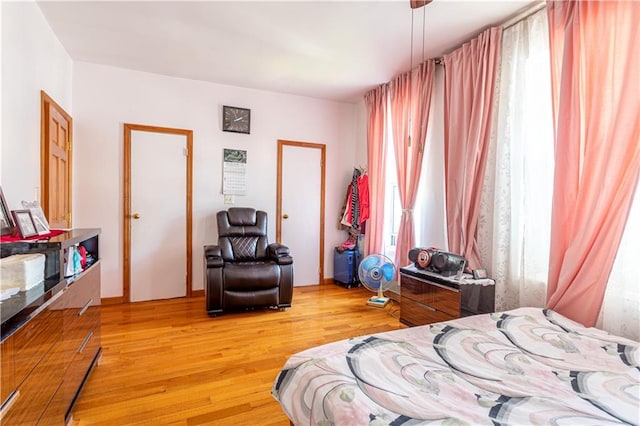 bedroom featuring light wood-style flooring