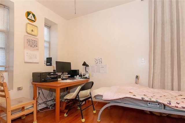 home office with wood finished floors