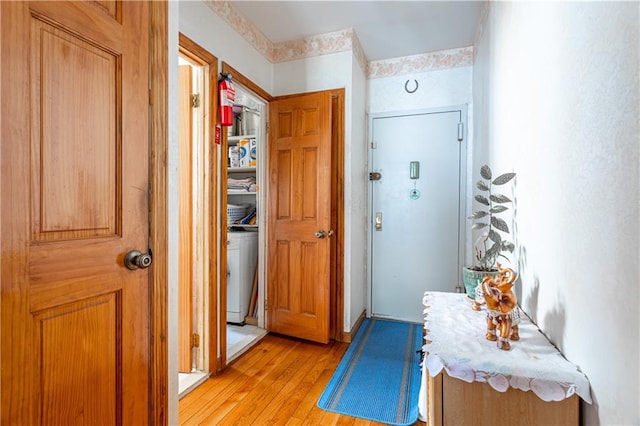 corridor with light wood-style flooring