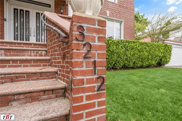 exterior details featuring brick siding