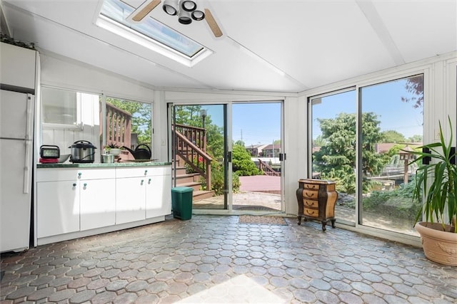 2729 Shore Dr, Merrick, NY 11566 - sunroom with vaulted ceiling with skylight and a wealth of natural light