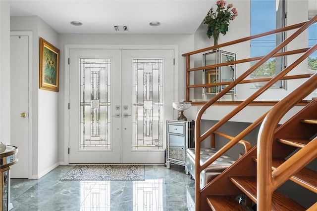 2729 Shore Dr, Merrick, NY 11566 - doorway to outside with french doors, marble finish floor, baseboards, visible vents, and stairway