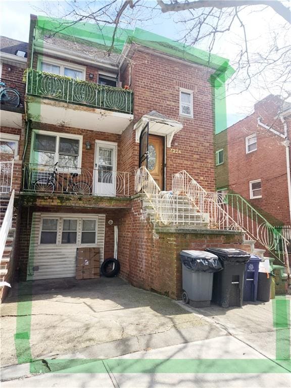 rear view of property with a balcony