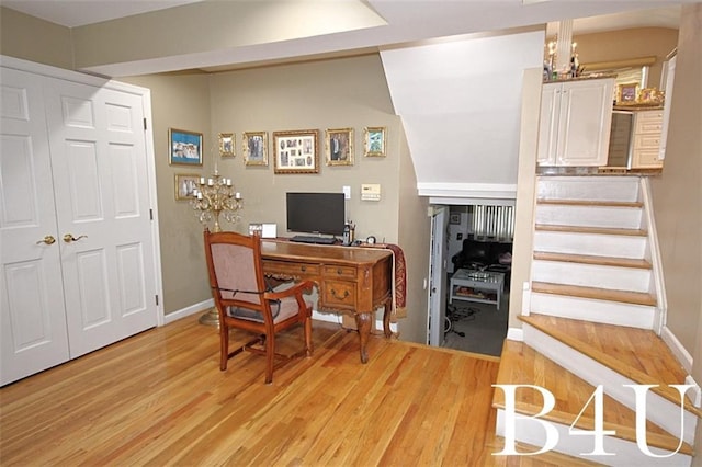 office area with baseboards and light wood-style floors