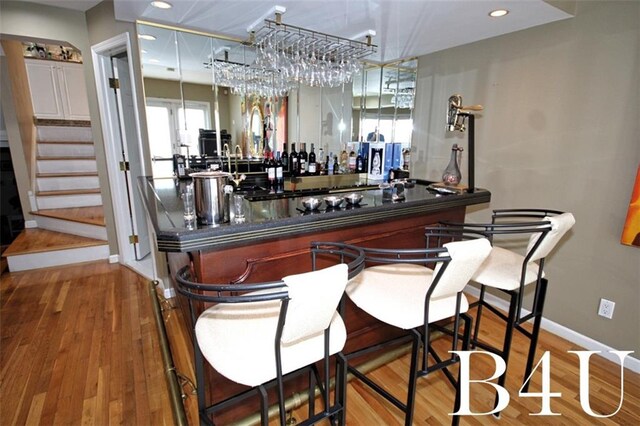 bar featuring wood-type flooring