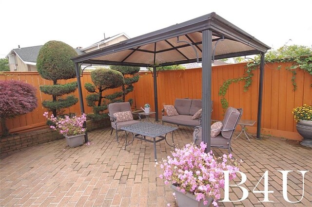 view of patio / terrace with a gazebo and an outdoor hangout area