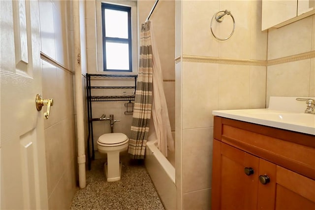 bathroom featuring vanity, tile walls, shower / tub combo, and toilet